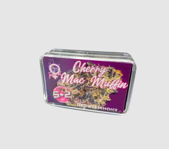 a tin of candy mac muffins on a white background