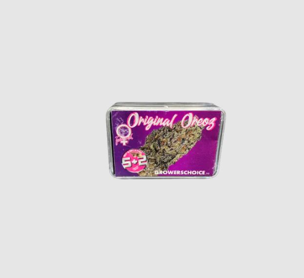 a small tin of marijuana sitting on top of a table