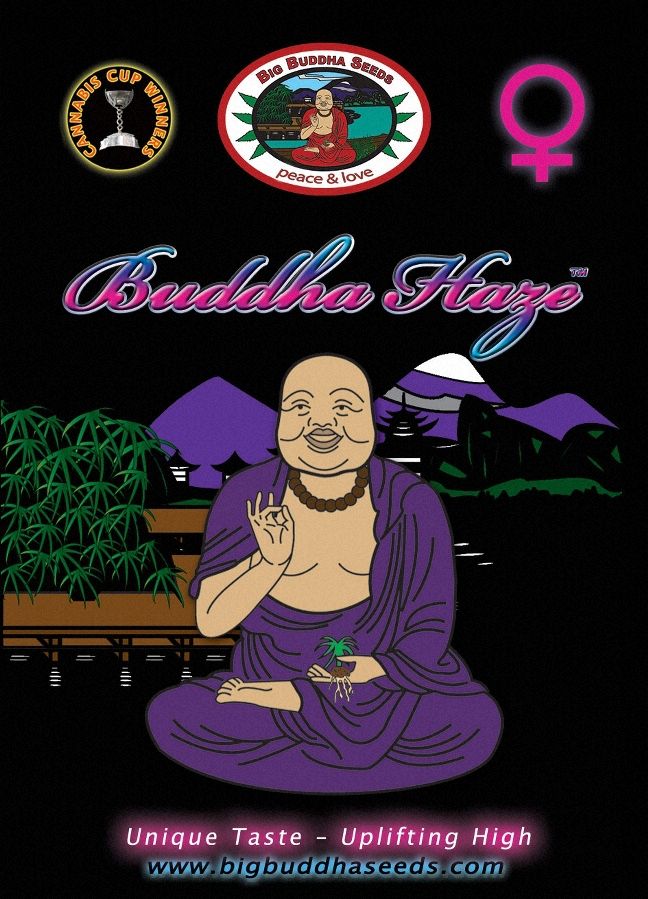 a buddha statue sitting on top of a table