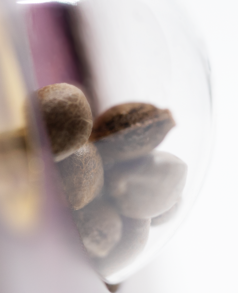 a close up of nuts in a glass container