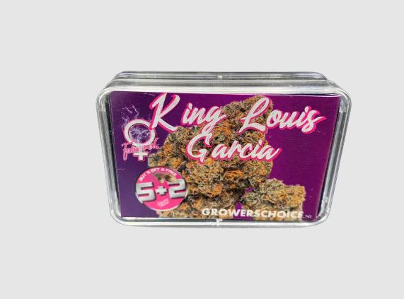 a tin of purple marijuana sitting on top of a table