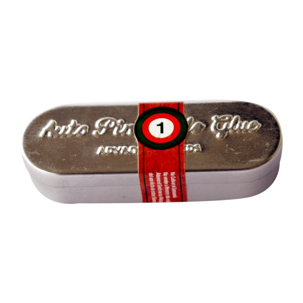 a metal tin with a red ribbon around it